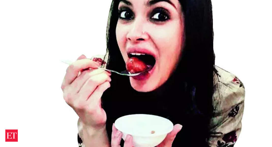 Biting into a Gulab Jamun