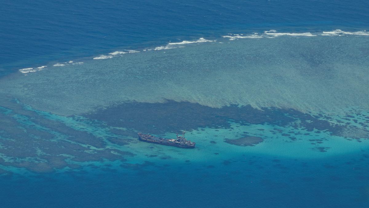 China says Philippine vessel illegally landed on disputed atoll